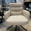 Image of Sillón Doha giratorio tapizado en tela con patas de hierro negro.