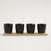 Image of Set x4 copetineros de porcelana negra con base de bamboo