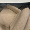 Image of Sillón Doha giratorio tapizado en tela con patas de hierro negro.