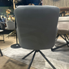 Image of Sillón Doha giratorio tapizado en tela con patas de hierro negro.