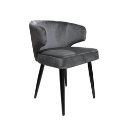 Silla Aston con patas de madera y asiento tapizado en pana.