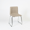Image of Silla Quina tapizada en color beige base trineo cromada.