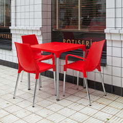 Silla Lola plástica roja con apoyabrazos y patas cromadas
