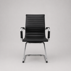 Sillón Aluminium tapizado en ecocuero pata trineo- color negro y blanco